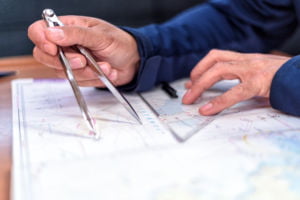 navigation in the chart room on a sailing yacht